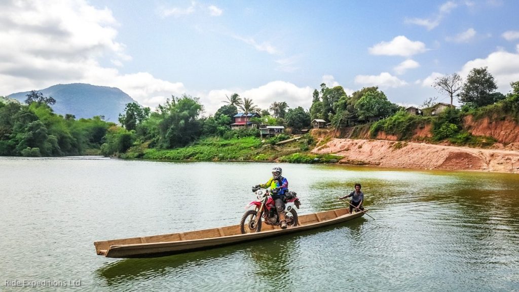 Canoe bike crossing in Laos on the Ho Chi Minh Trail.