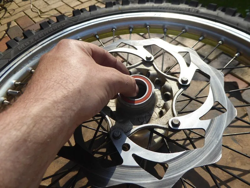 Wheel-bearing-change-10 – Wheel bearing replacement on a dirt bike is an occupational hazard. On (Motorcycle Maintenance)