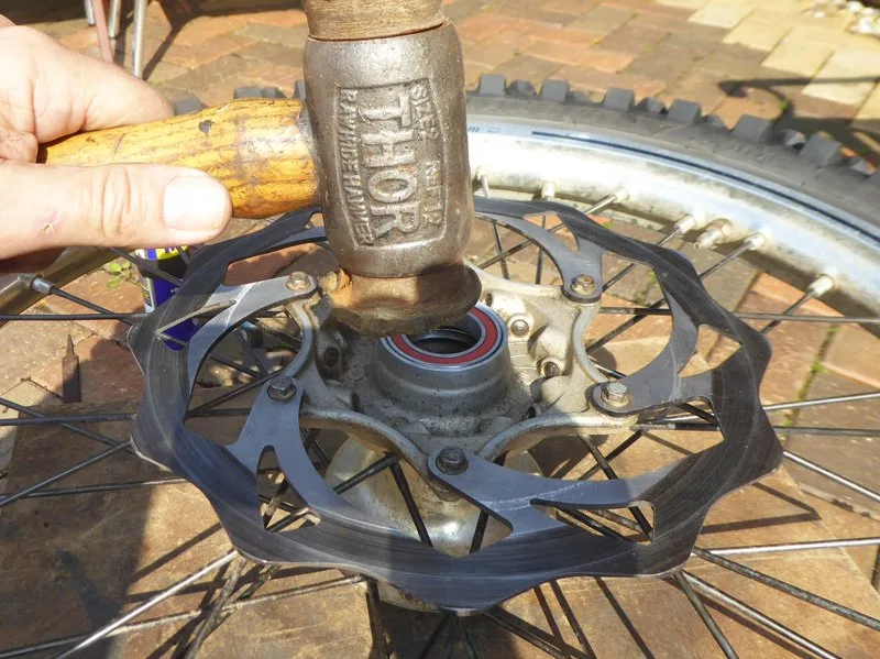 Wheel-bearing-change-11 – Wheel bearing replacement on a dirt bike is an occupational hazard. On (Motorcycle Maintenance)