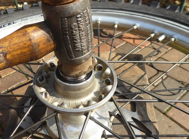 Wheel-bearing-change-2 – Wheel bearing replacement on a dirt bike is an occupational hazard. On (Motorcycle Maintenance)