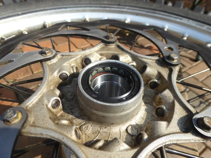 Wheel-bearing-change-3 – Wheel bearing replacement on a dirt bike is an occupational hazard. On (Motorcycle Maintenance)