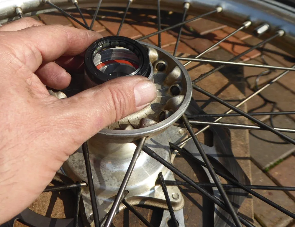 Wheel-bearing-change-6 – Wheel bearing replacement on a dirt bike is an occupational hazard. On (Motorcycle Maintenance)
