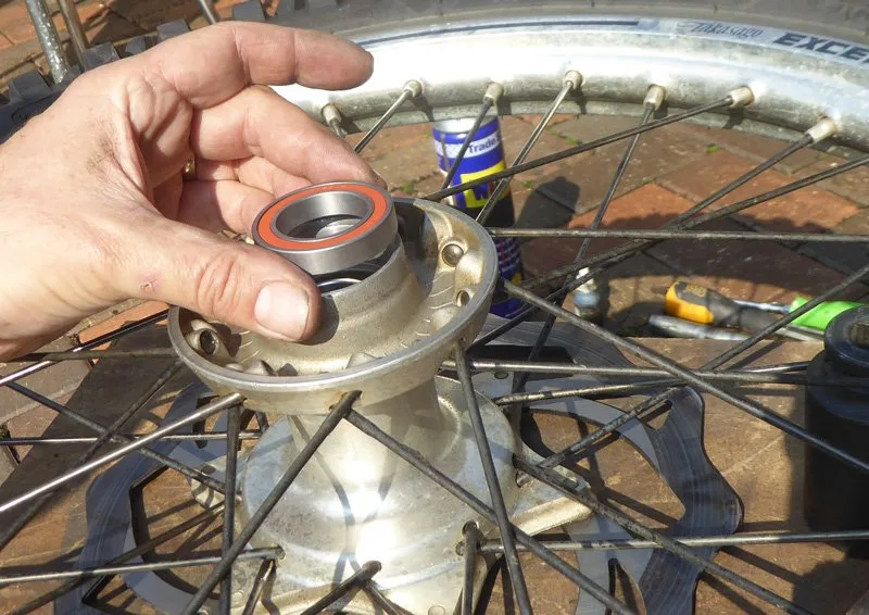 Wheel-bearing-change-7 – Wheel bearing replacement on a dirt bike is an occupational hazard. On (Motorcycle Maintenance)