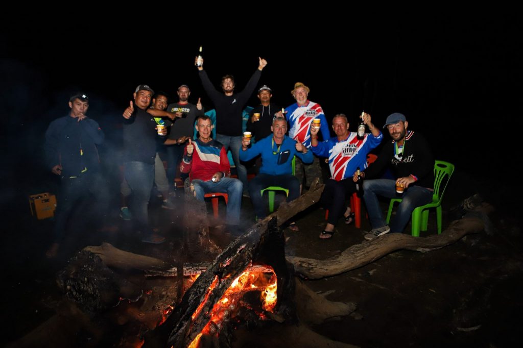 Riders gathered around the campfire in Loas.