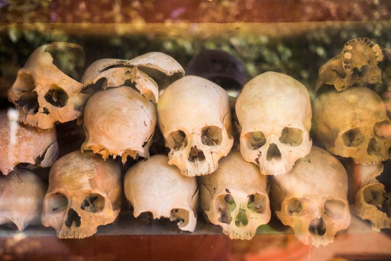 Pile of human skulls on a wat thmei at Siem Reap, Cambodia