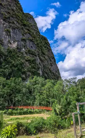 Ride high into the mountains, surrounded by dramatic karst limestone peaks