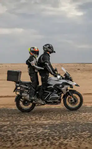 Ride through vast desert landscapes
