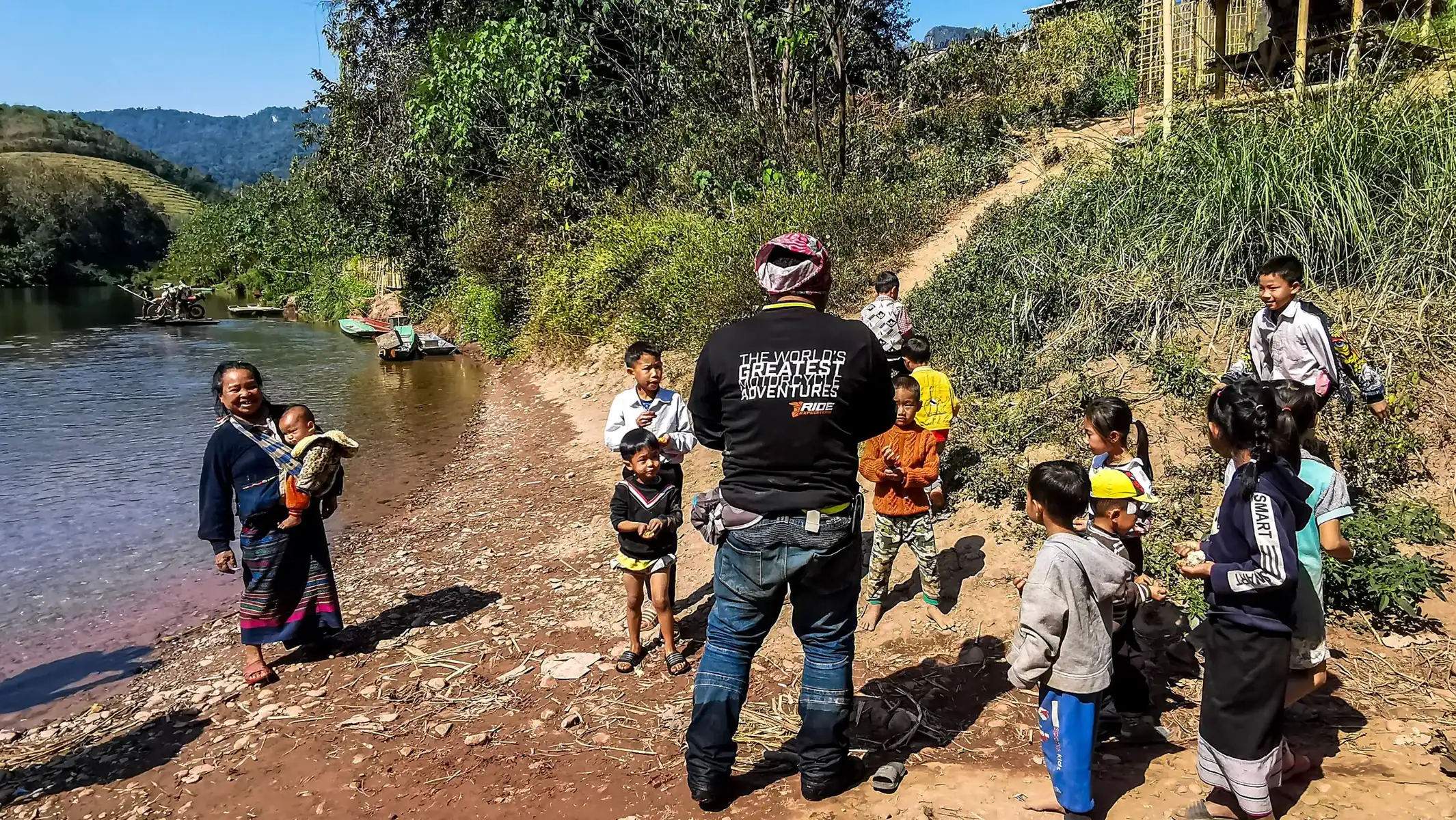 laos-dirt-bike-tour-river-crossing-local-children-12