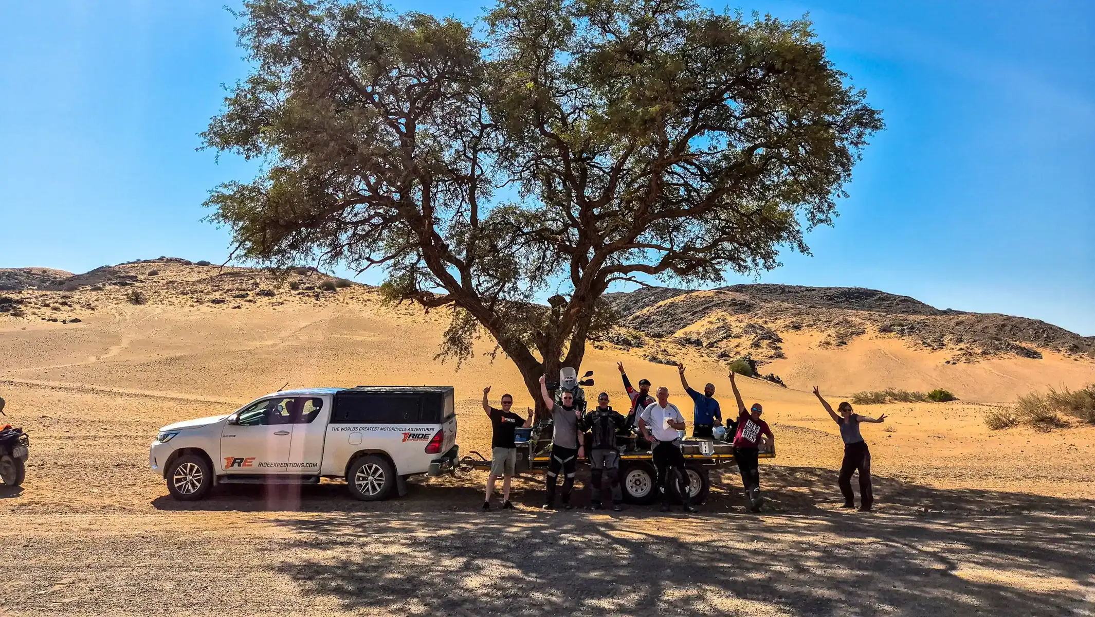 namibia-desert-motorcycle-tour-group-desert-stop-shade-12