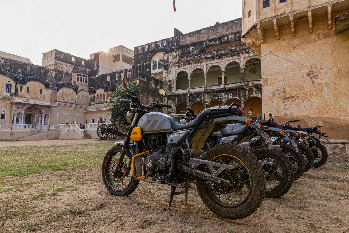 Royal Enfield motorcycles parked at the Castle Mandawa Hotel