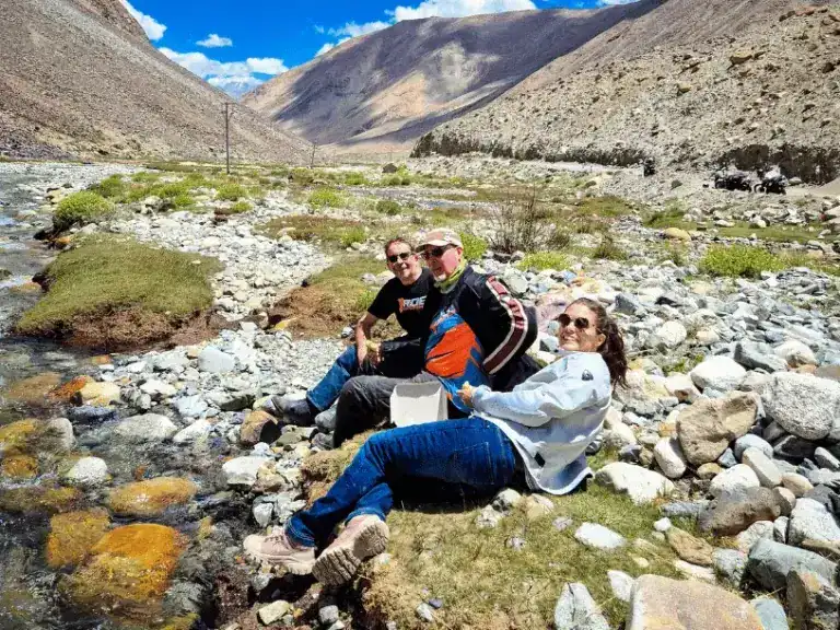 A picnic in the Himalayas by a stream