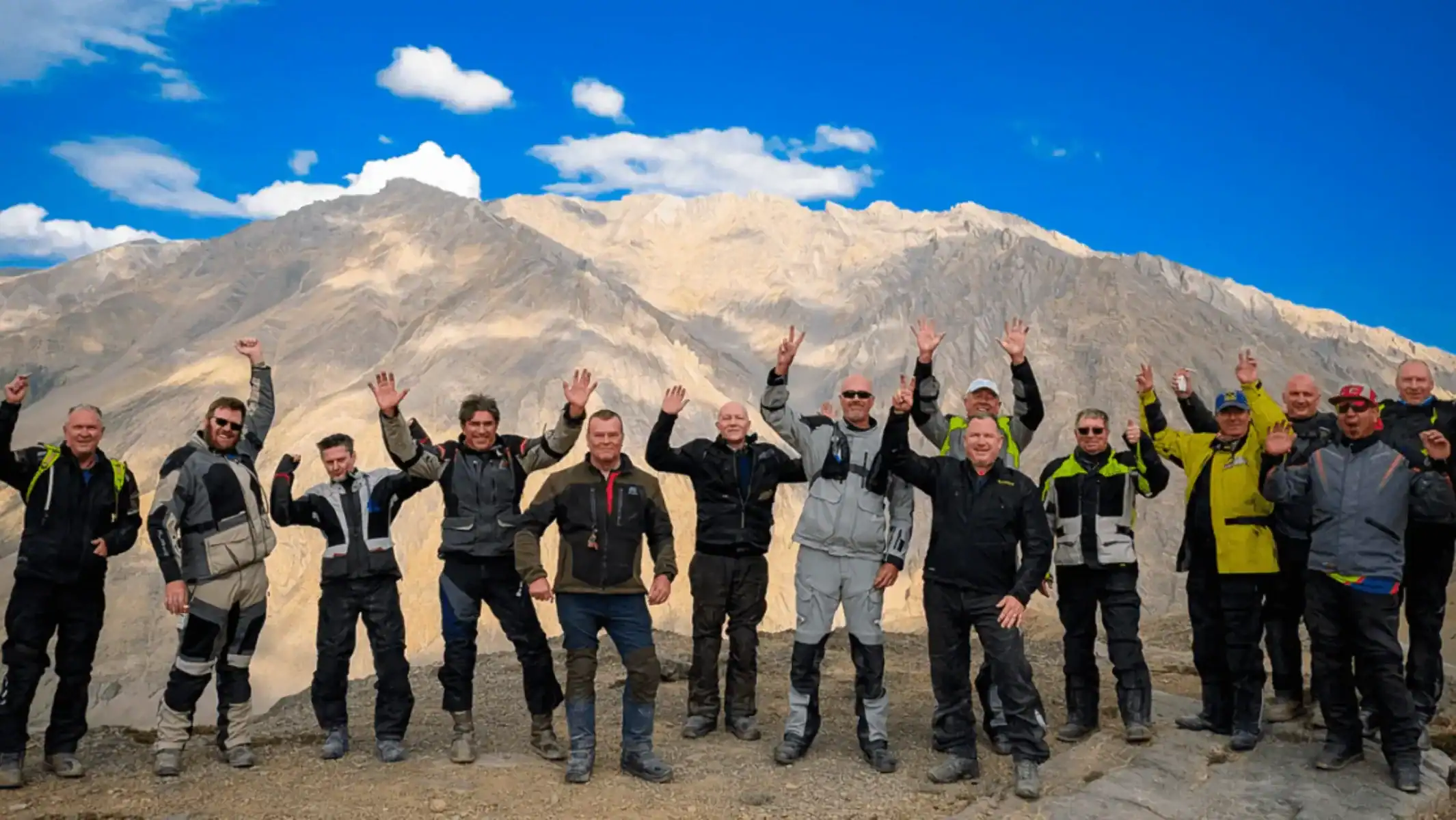 best-motorcycle-tour-himalayas-group-celebration-mountains-02