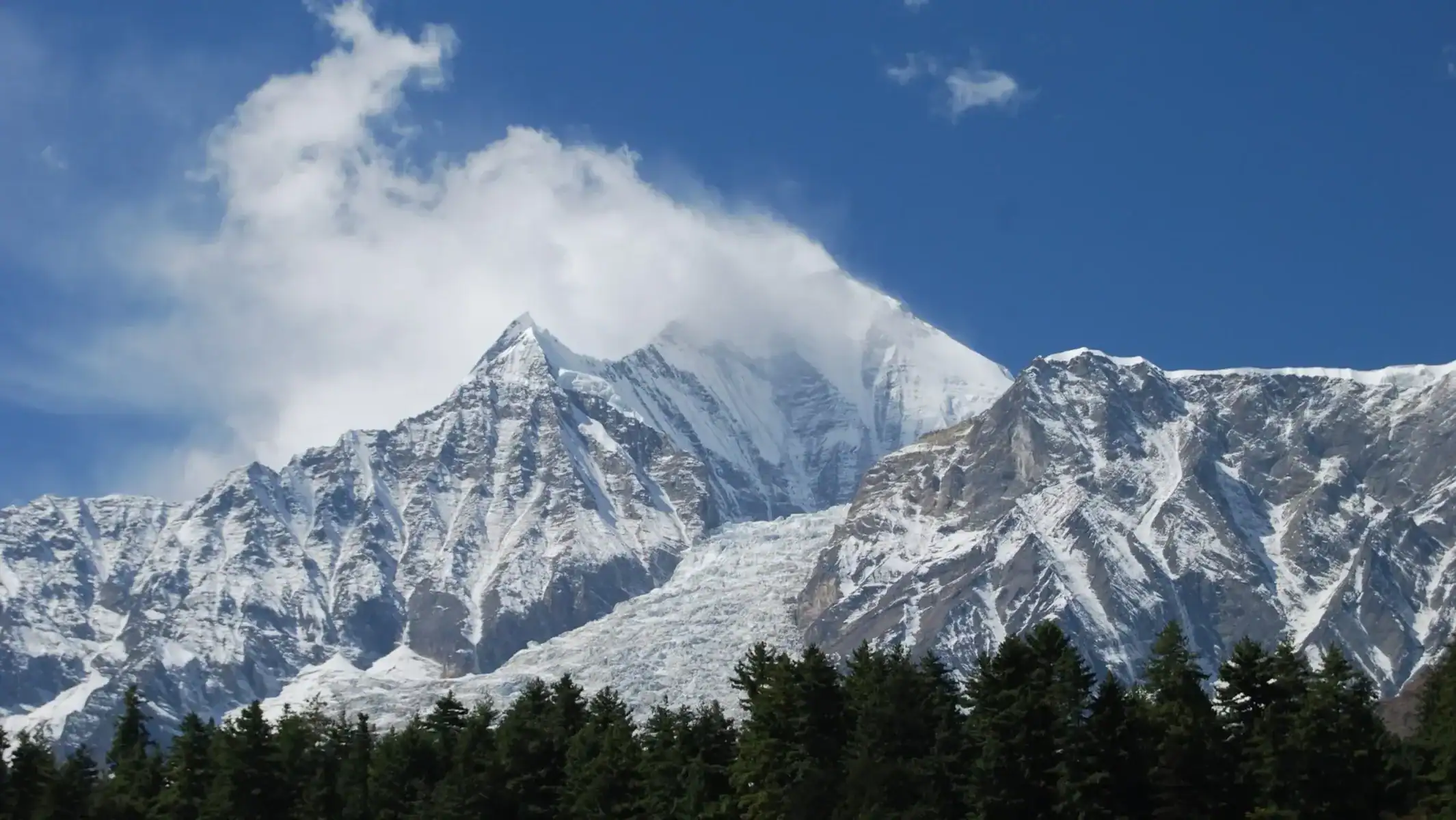 best-motorcycle-tour-himalayas-snow-peak-clouds-19