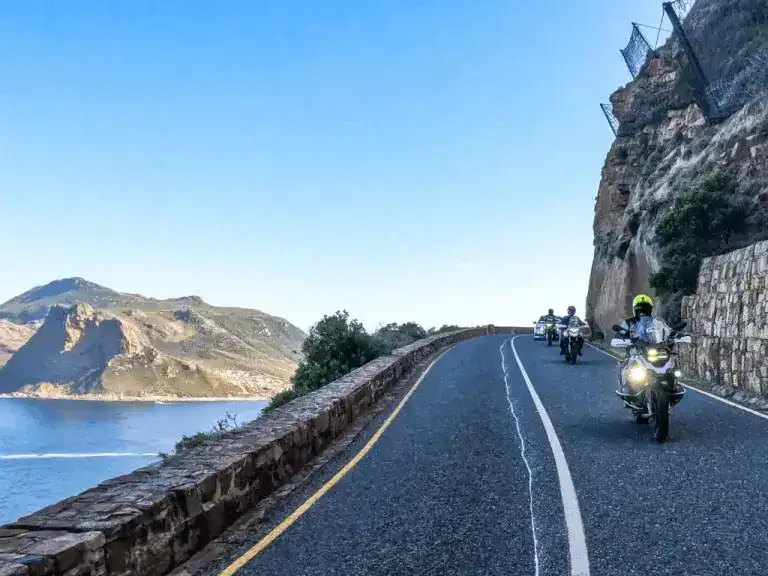 Riding adventure bikes along Chapman’s Peak Drive on the Ride Expeditions self-guided motorcycle tour.