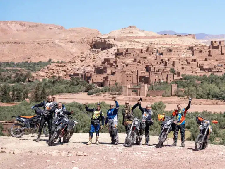 Riders visiting Aït Benhaddou during Morocco motorcycle tour through the Sahara