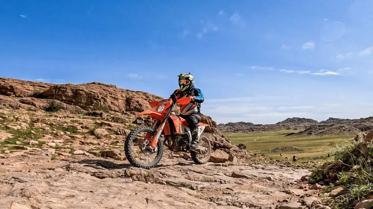 Enduro rider riding over rocky terrain in Mongolia on the KTM 450 EXC
